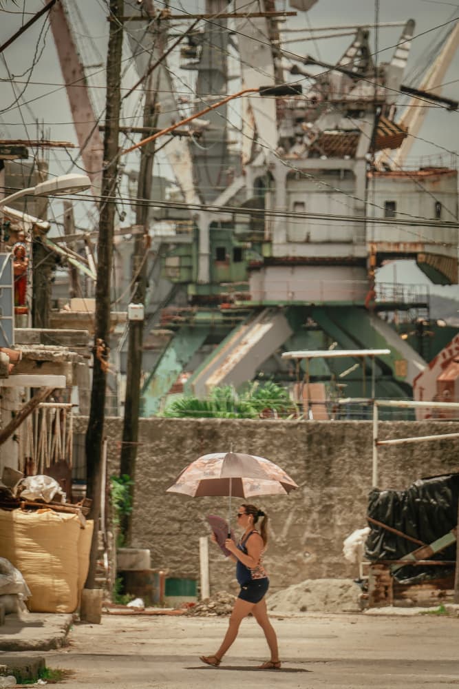 Woman Under Urban Sun by Andy Bauer — canvas wall art