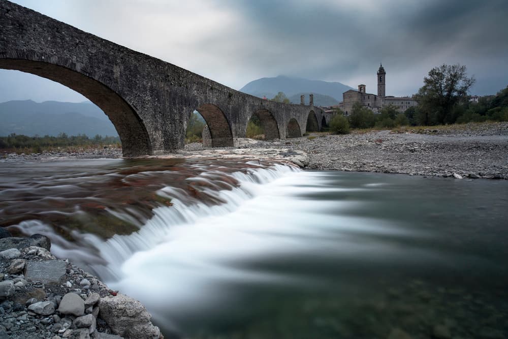 Ancient Bridge River Flow by Dorian Gray — canvas wall art