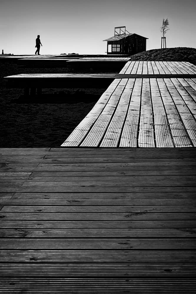 Monochrome Boardwalk Solitude by Paulo Abrantes — canvas wall art
