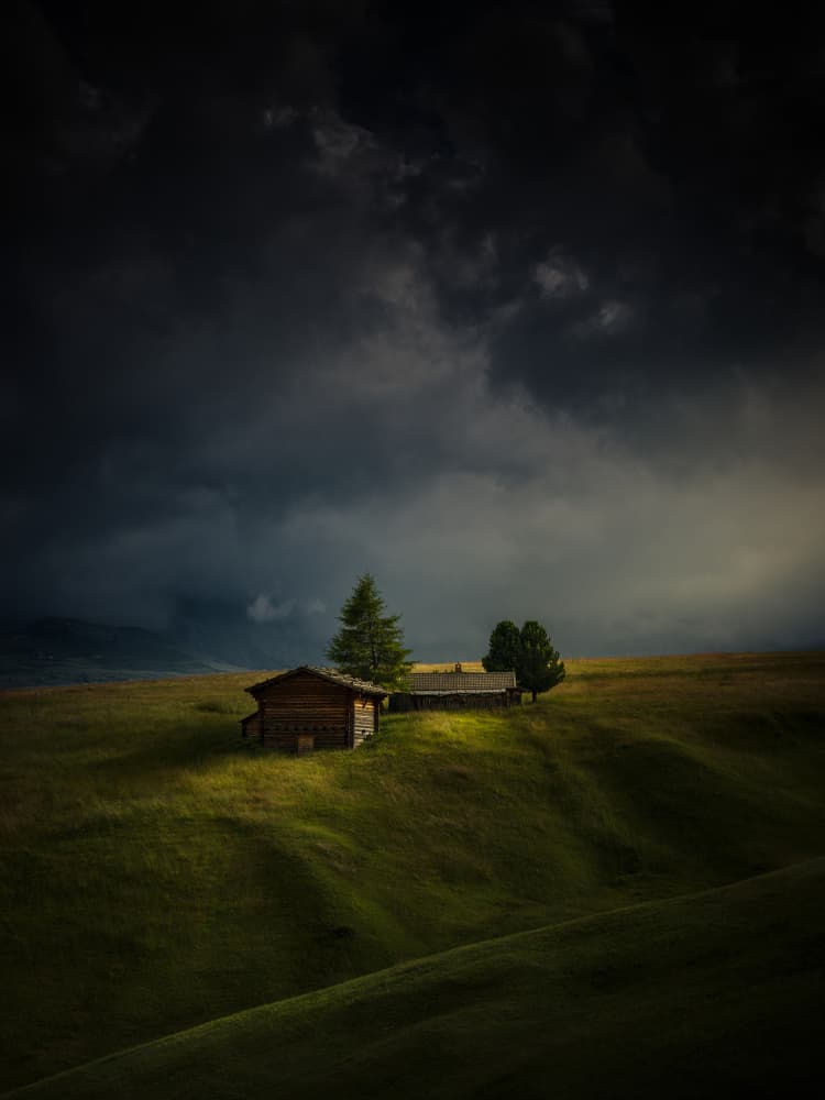 Secluded Huts Stormy Sky by Radek Pohnan — canvas wall art