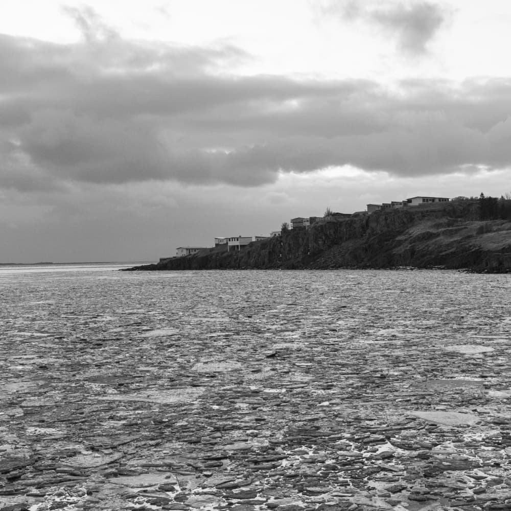 Frozen Bay Cliffside by Lynann Colligan — canvas wall art