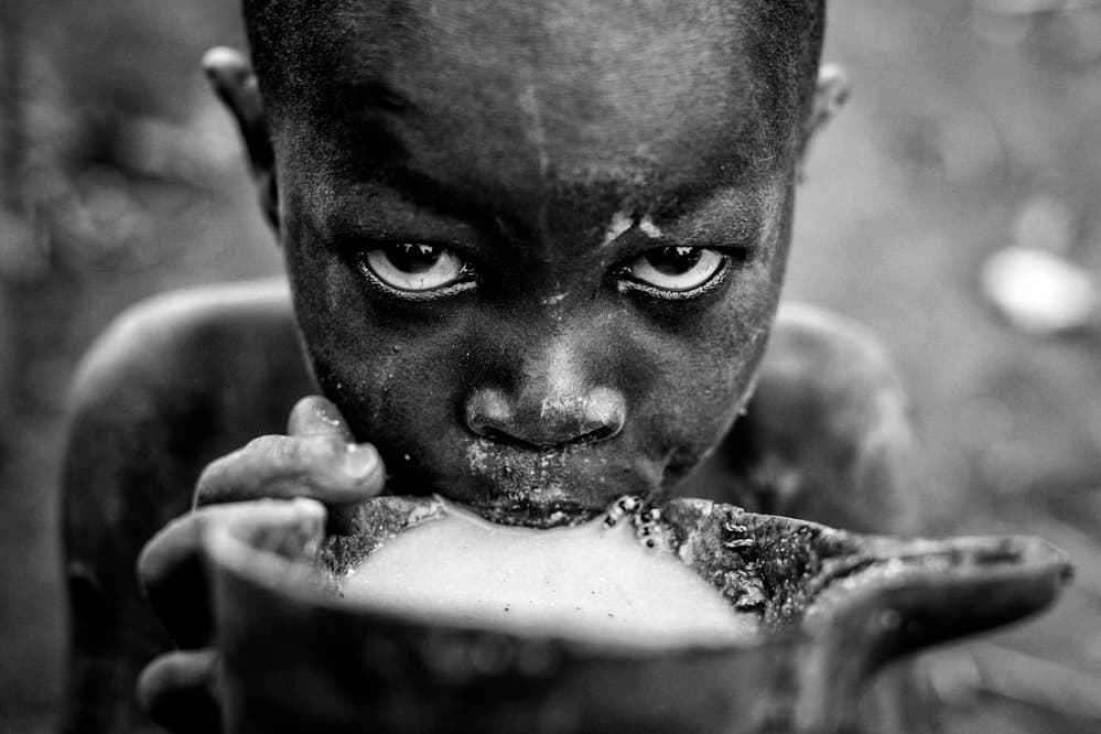 Intense Young Boy Drinking by Vedran Vidak — canvas wall art