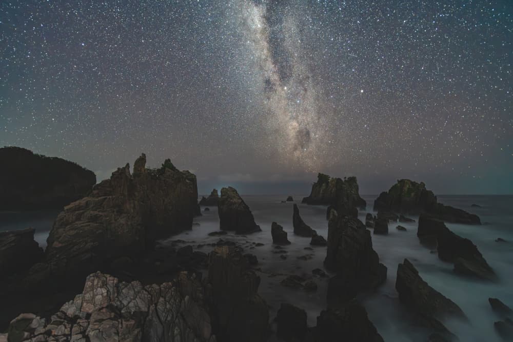 Night Sky Rocky Coast by HIRAK BHATTACHARJEE — canvas wall art