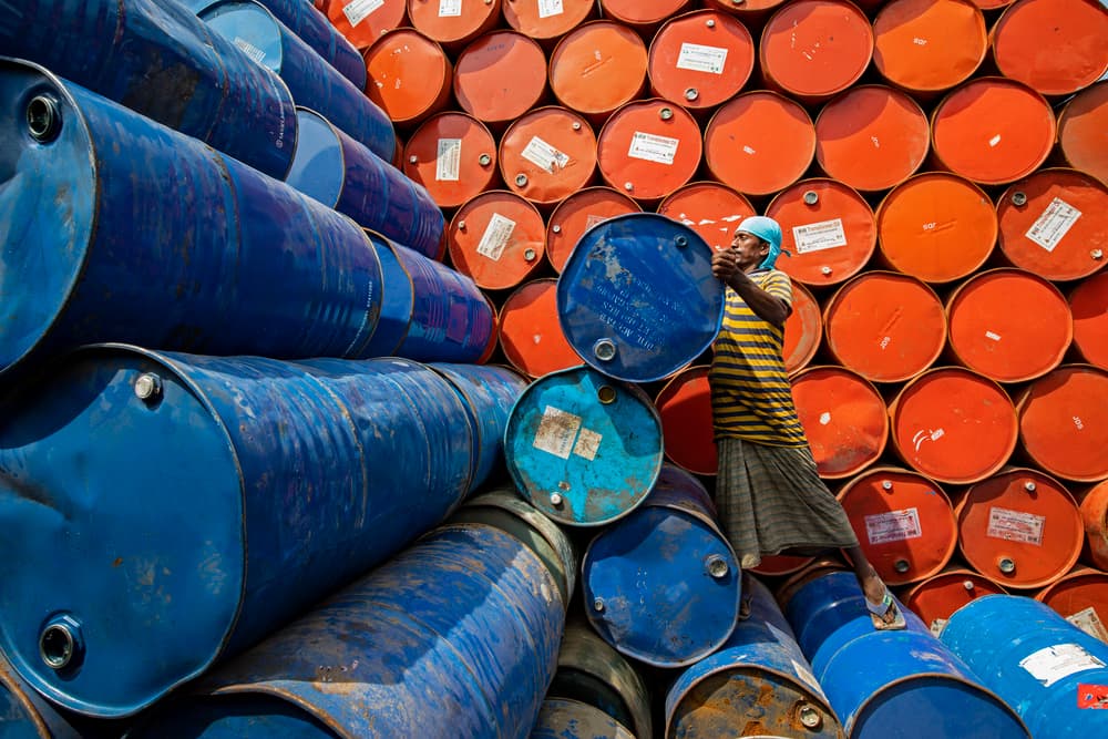 Worker Stacking Barrels by Azim Khan Ronnie — canvas wall art
