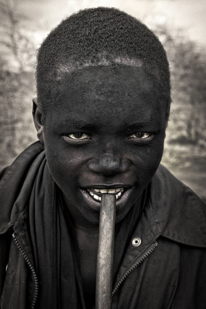 Smiling Boy With Stick by Mark Boyle — canvas wall art
