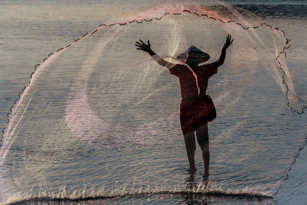 Fisherman Casting Net by Andy Bauer — canvas wall art