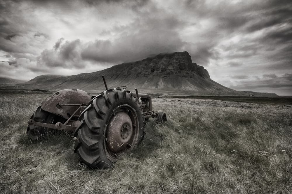 Rusty Tractor Mountain Field by Þorsteinn H. Ingibergsson — canvas wall art