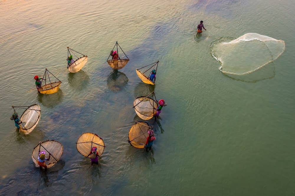 Traditional River Fishing by Saurabh Sirohiya — canvas wall art