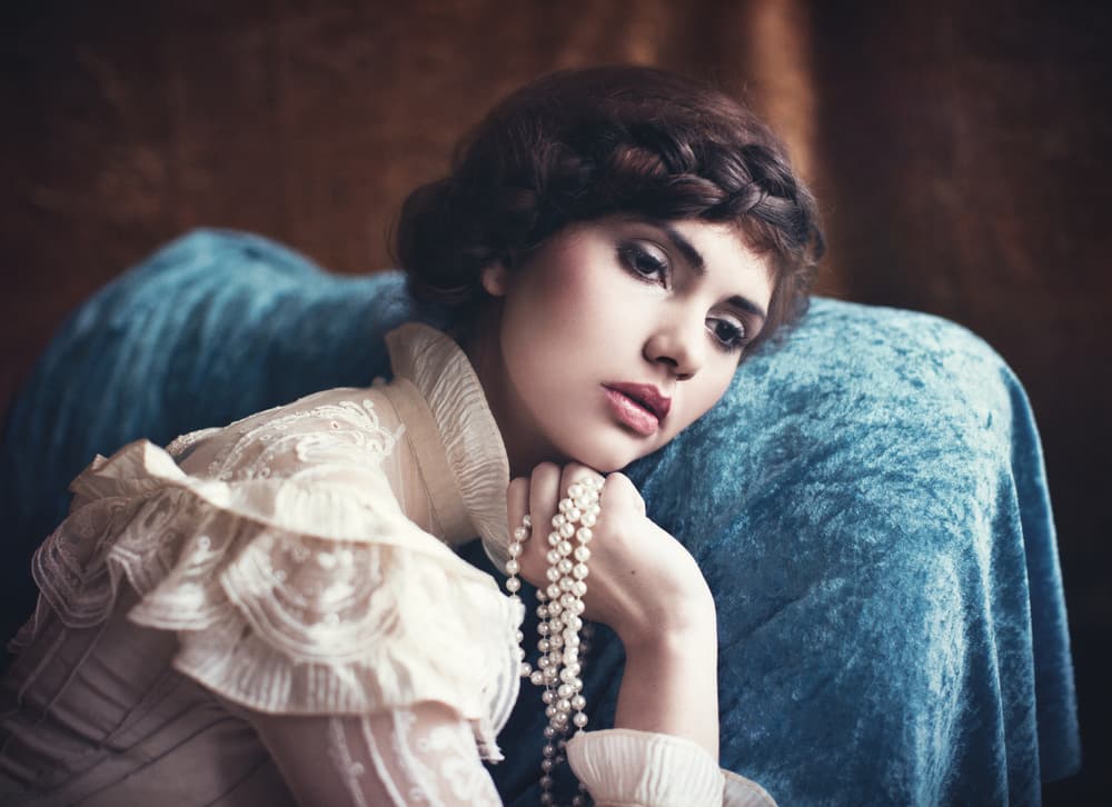 Pensive Woman with Pearls by Magdalena Russocka — canvas wall art