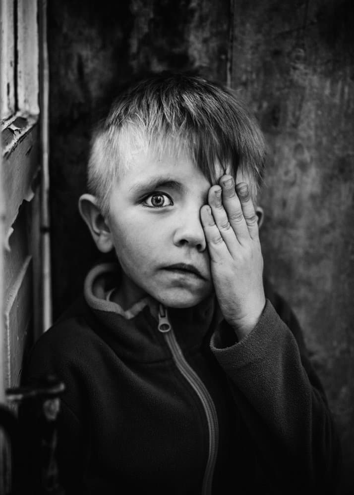 Boy's Intense Gaze by Olessya Mikhailova — canvas wall art