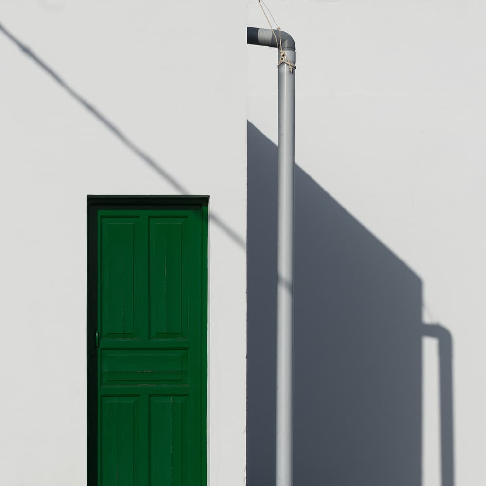 Green Door Strong Shadows by Andy Bauer — canvas wall art
