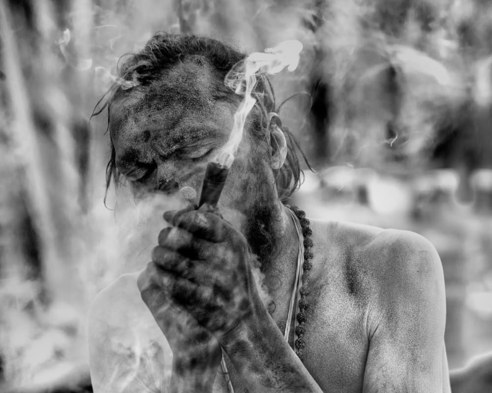 Intense Sadhu Smoking by Giovanni Cavalli — canvas wall art