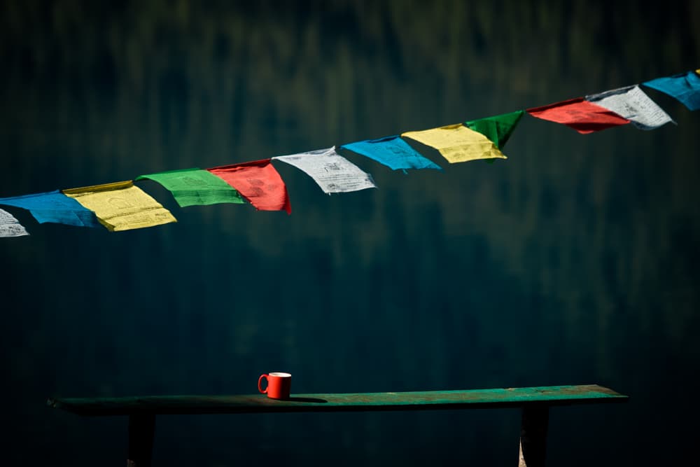 Serene Prayer Flags And Mug by Ivano Cheli — canvas wall art