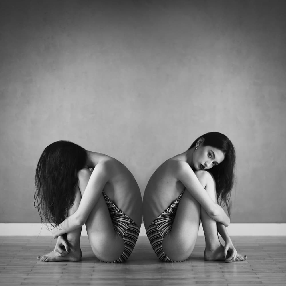 Pensive Seated Figures by Mateusz Filipiuk — canvas wall art