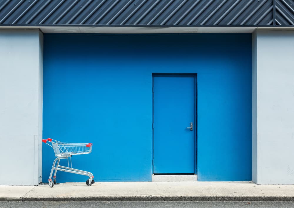 Blue Wall Shopping Cart by Jacqueline Hammer — canvas wall art