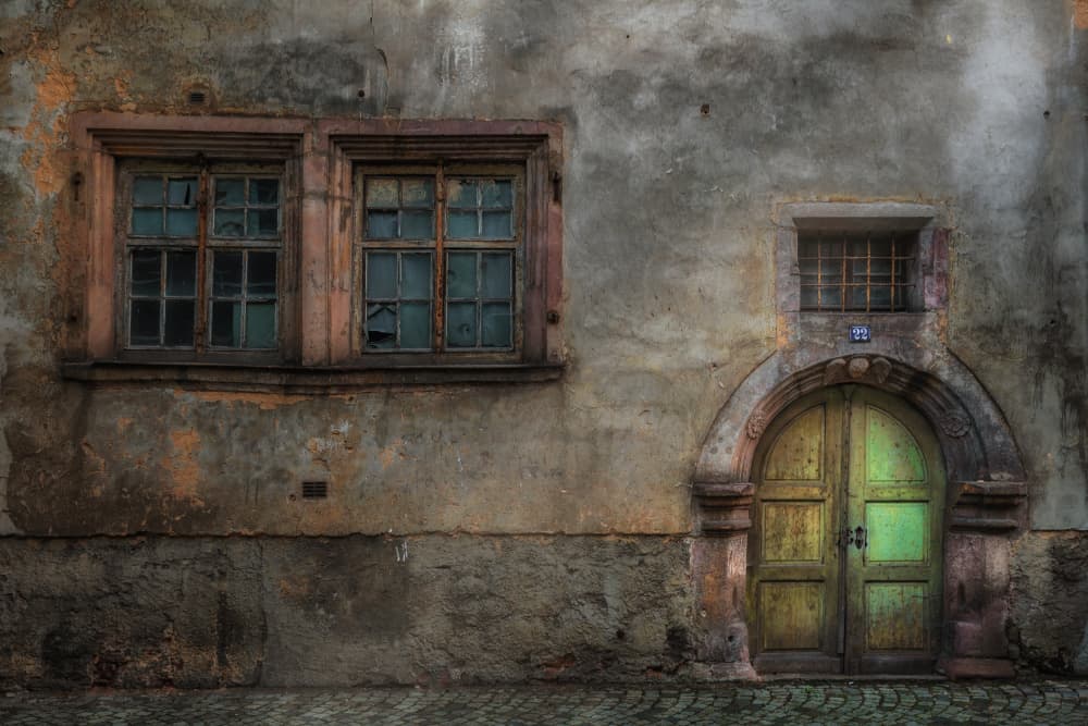 Aged Green Door Facade by Hans Günther — canvas wall art