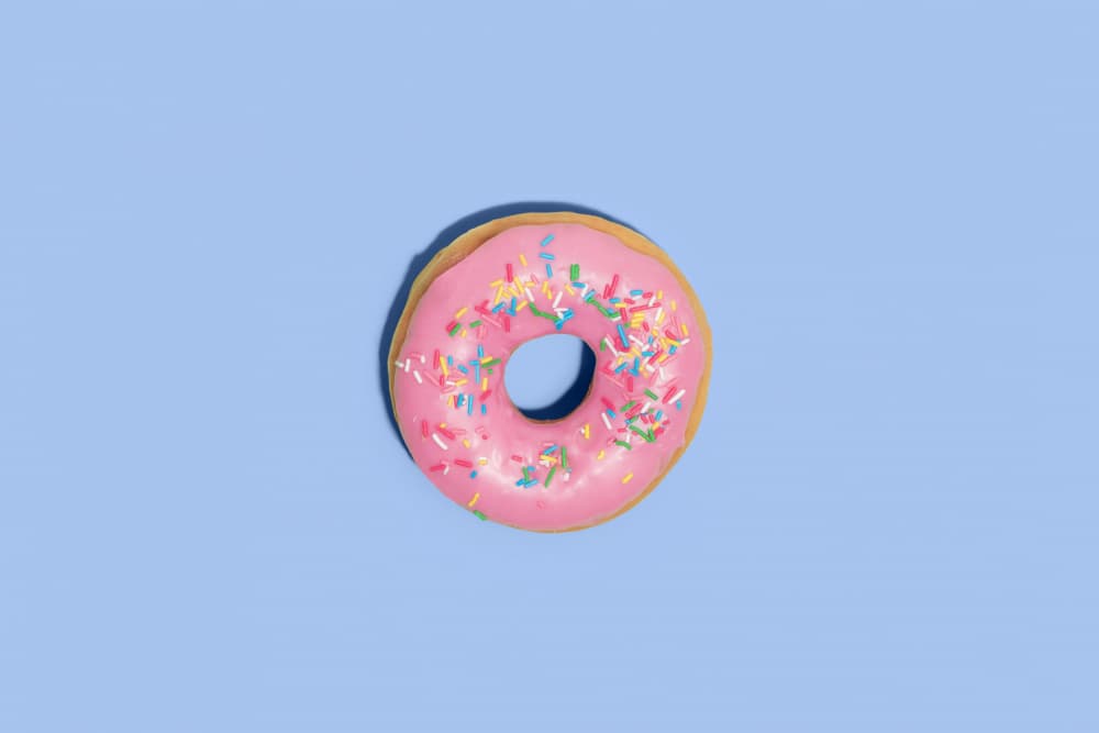 Pink Sprinkled Donut by Julia Ramiro — canvas wall art