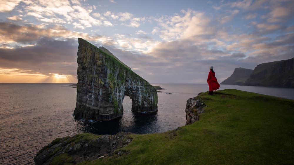 Red Coat Sea Stack by April Xie — canvas wall art