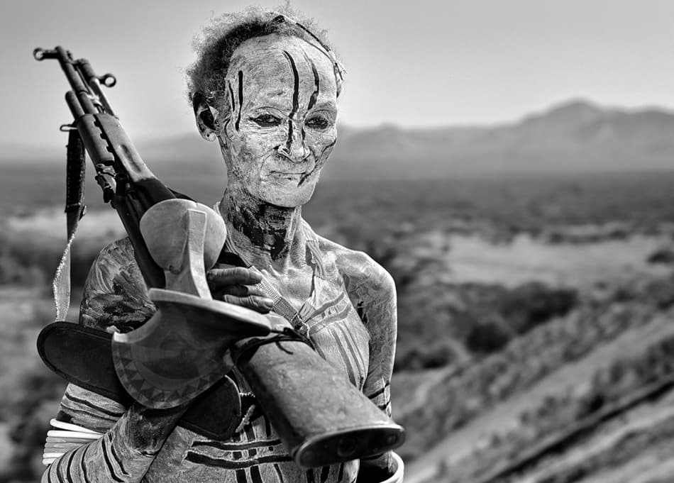 Tribal Man with Rifle by Izidor Gasperlin — canvas wall art