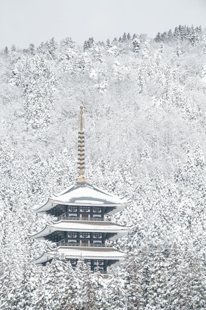 Snowy Japanese Pagoda by Naoya Yoshida — canvas wall art
