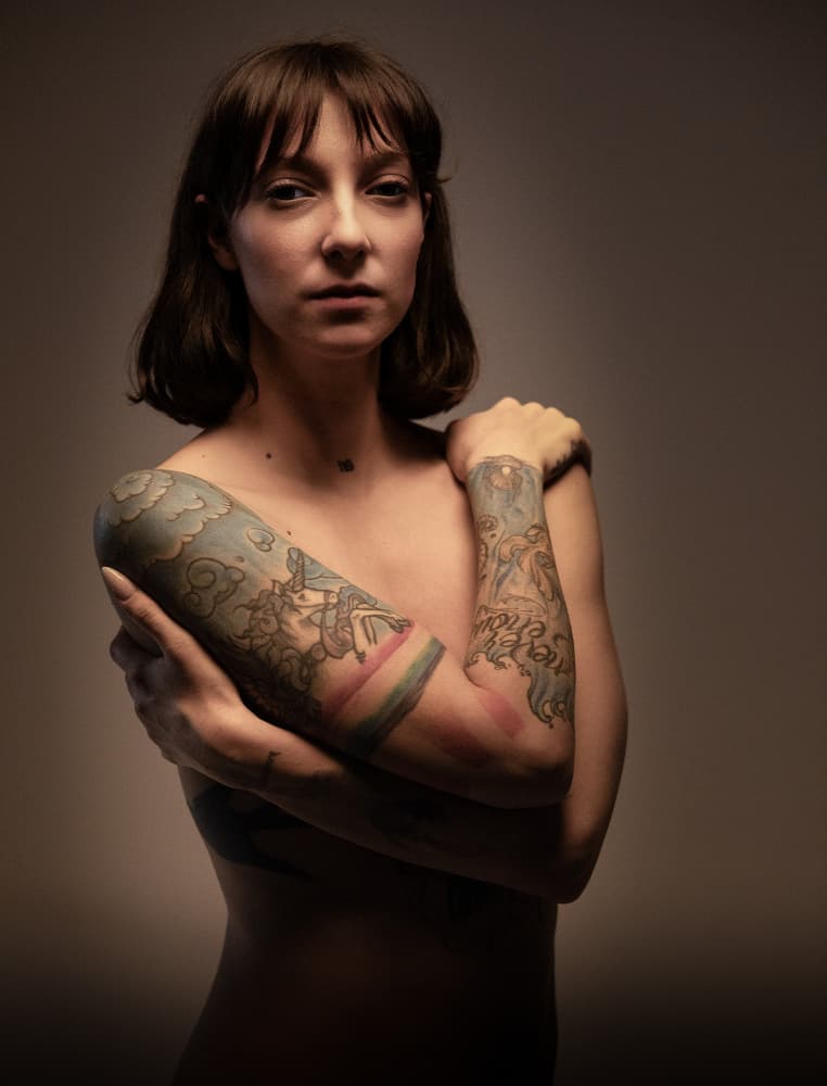 Tattooed Woman Self Embrace by Enis Onur — canvas wall art
