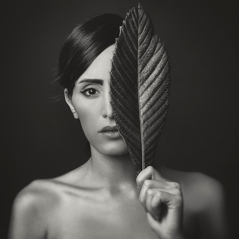 Mysterious Woman with Leaf by Amin Hamidnezhad — canvas wall art