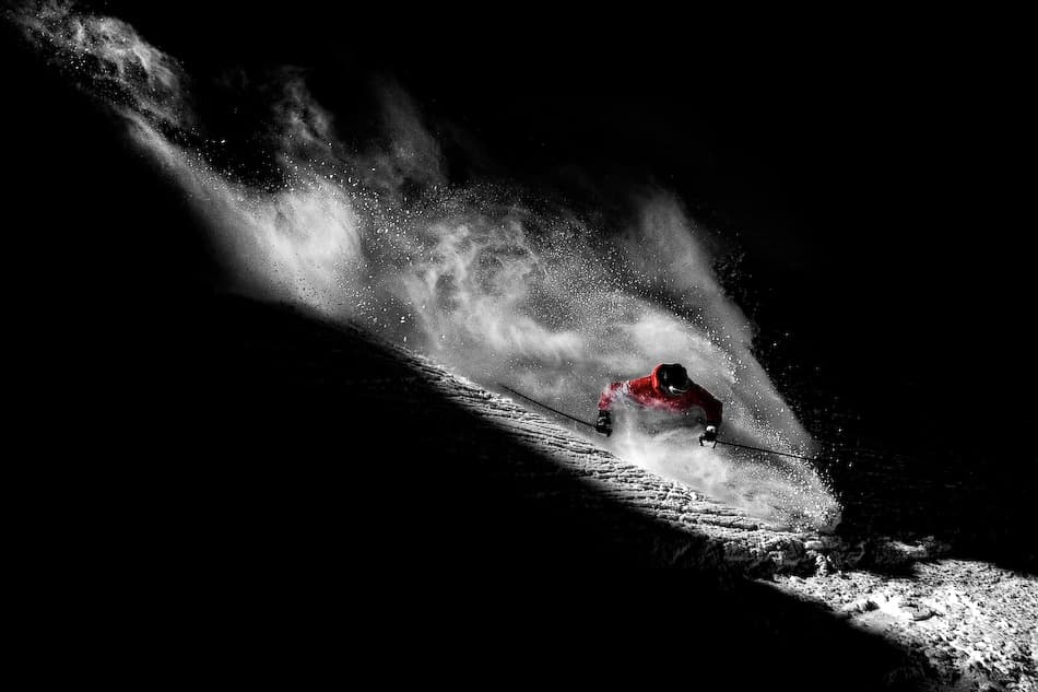 Red Skier Powder Spray by Tristan Shu — canvas wall art