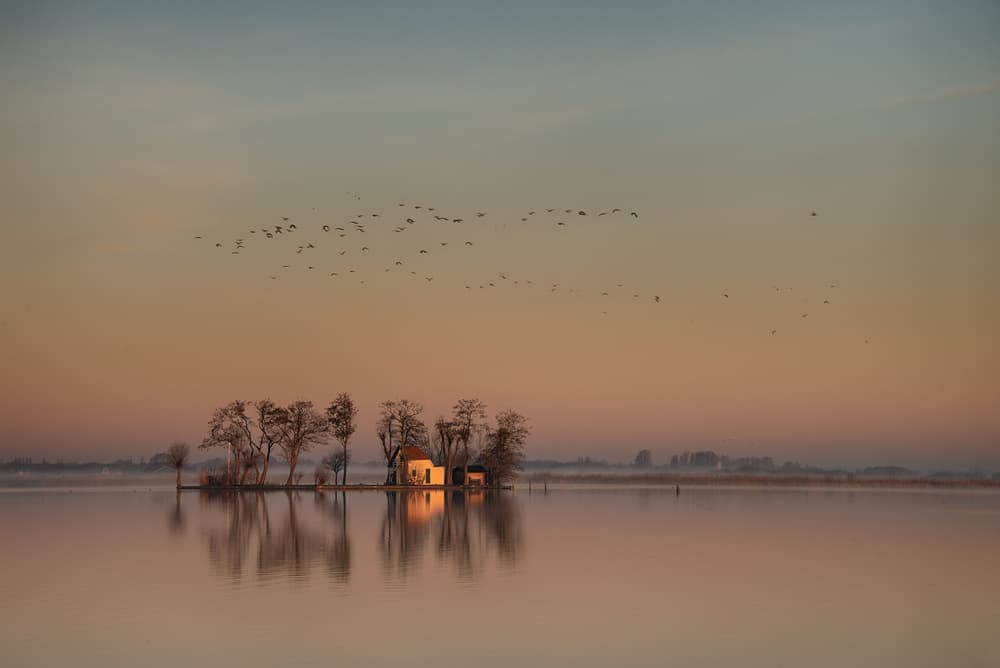 Tranquil Lake House Reflection by Piet Haaksma — canvas wall art