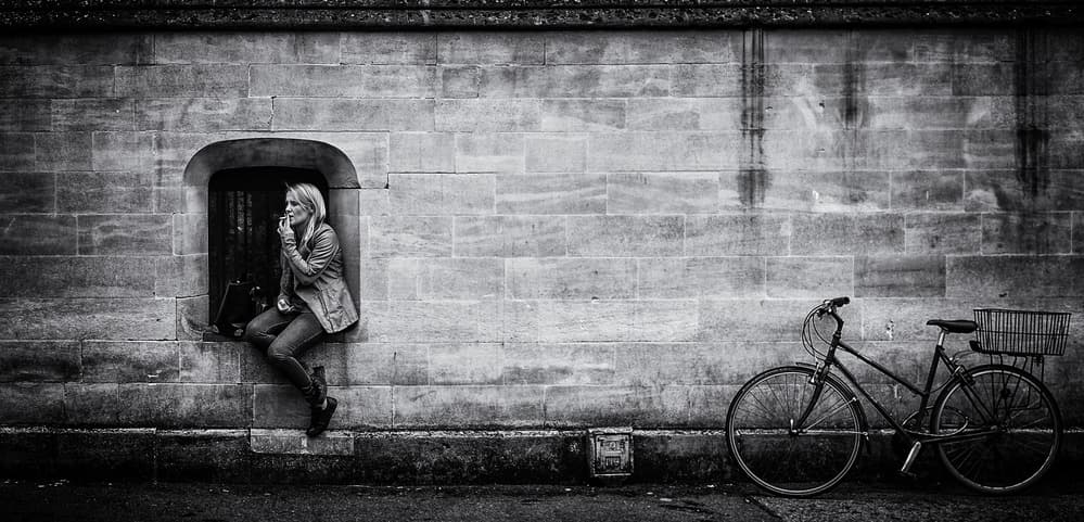 Woman Smoking City Street by Pawel Majewski — canvas wall art