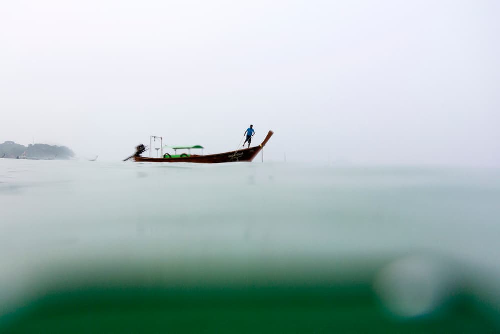 Misty Ocean Boatman by Gina Buliga — canvas wall art