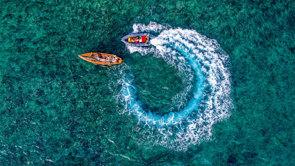 Speedboat Circles Turquoise Sea by Ido Meirovich — canvas wall art