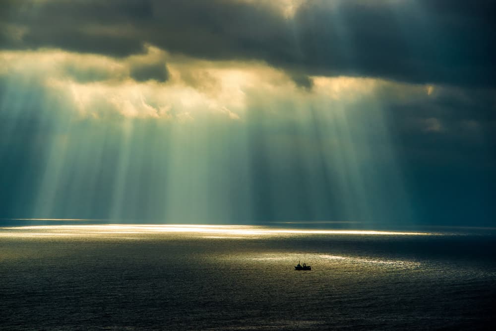 Sun Rays Over Ocean by Dmitry Nesvetaylov — canvas wall art