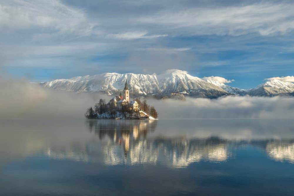 Bled Island Winter Reflection by Bojan Kolman — canvas wall art