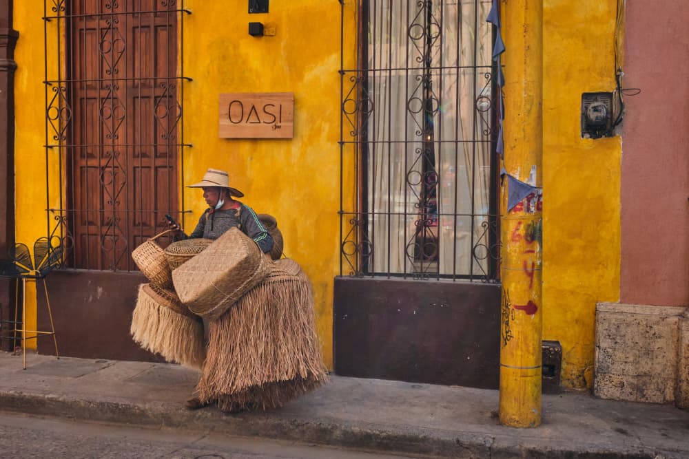 Straw Vendor Walking by Avital Hershkovitz — canvas wall art