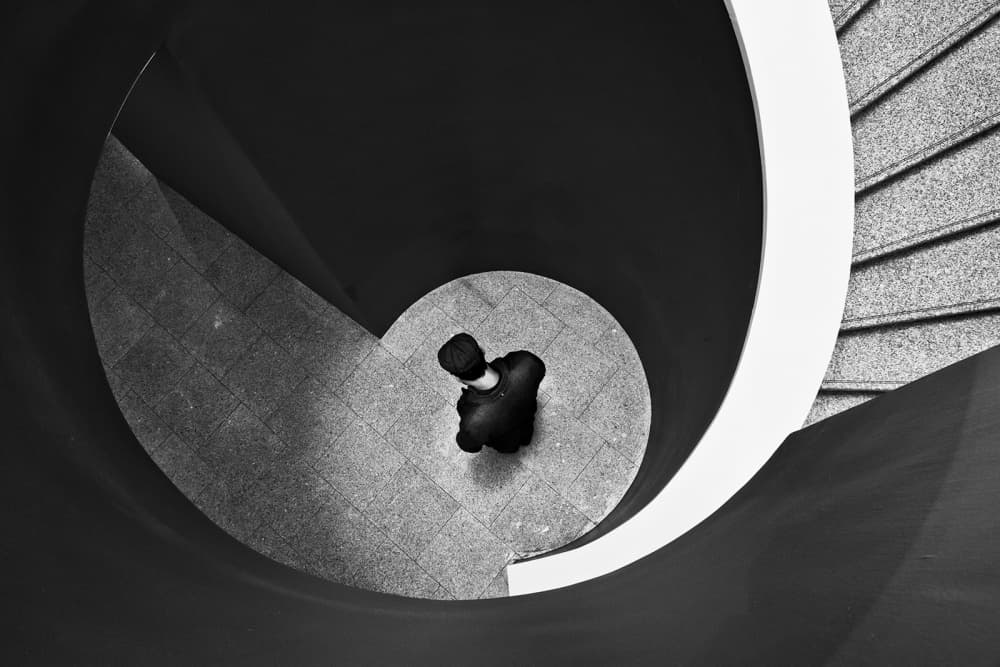 Man on Spiral Steps by Luis Sarmento — canvas wall art