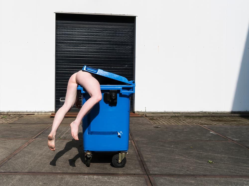 Legs in Blue Dumpster by Ton Dirven — canvas wall art