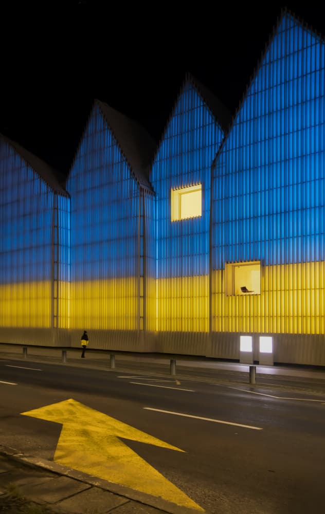 Blue Yellow Illuminated Building by Anna Niemiec — canvas wall art