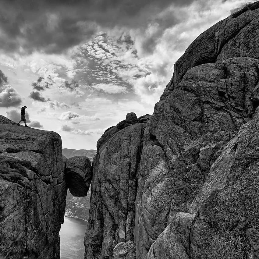 Adventurer on Suspended Rock by Roman Lipinski © czeladnik — canvas wall art