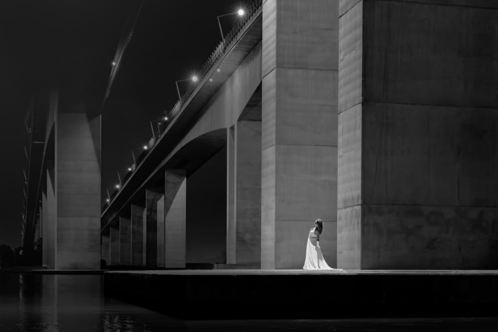 Elegant Woman Under Bridge by Craig Stampfli — canvas wall art
