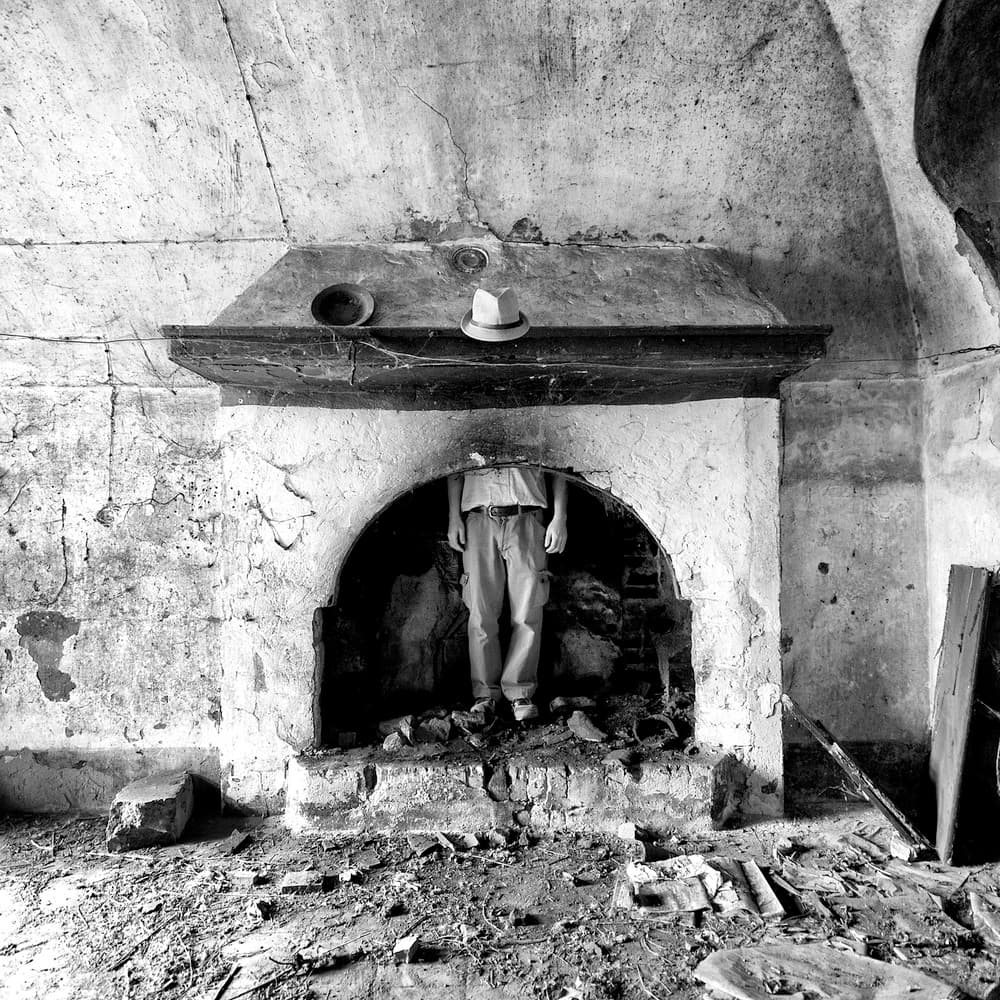 Headless Figure Fireplace by Carlo Ferrara — canvas wall art