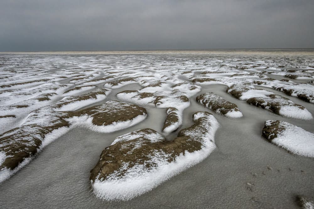 Frozen Winter Beach by Piet Haaksma — canvas wall art