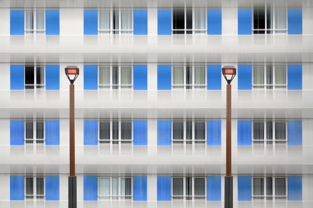 Blue Shutters Facade by Hans-Wolfgang Hawerkamp — canvas wall art