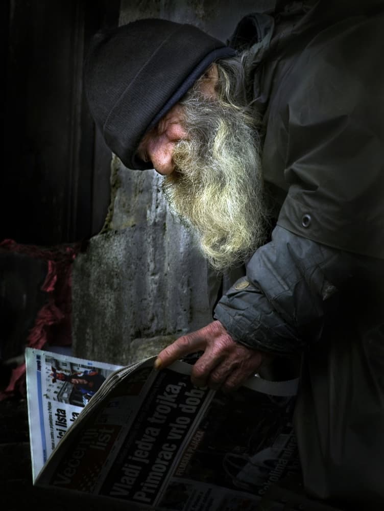 Bearded Man Reading News by Robert Semnic — canvas wall art