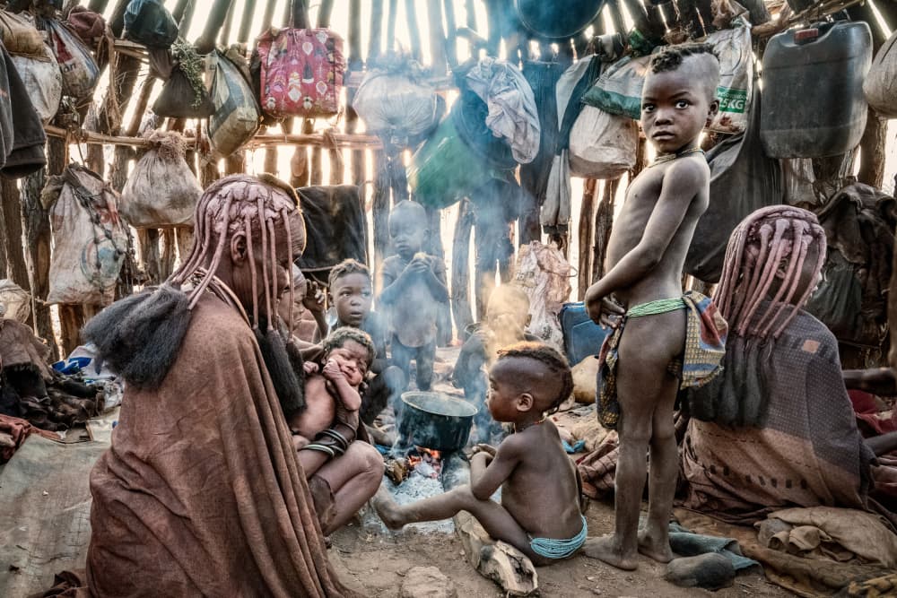 Himba Family Gathering by Trevor Cole — canvas wall art