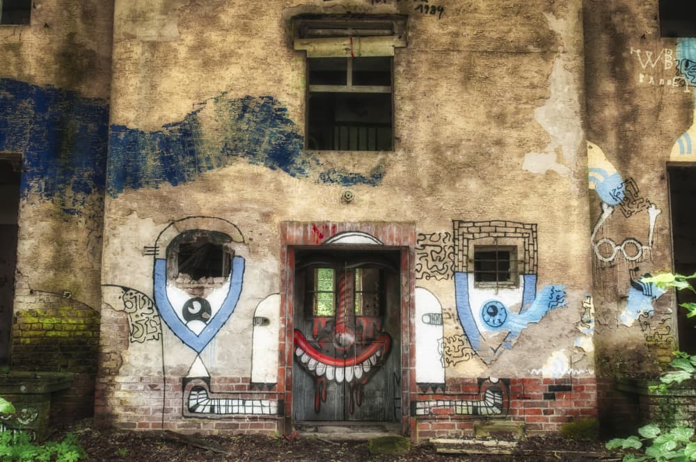 Creepy Smile Building by Rolf Lampert — canvas wall art
