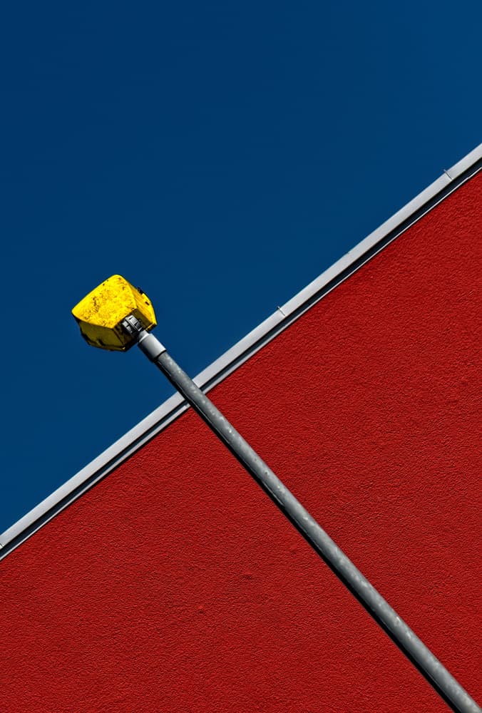Red Wall Yellow Light by Tomasz Buczkowski ( Tomush ) — canvas wall art