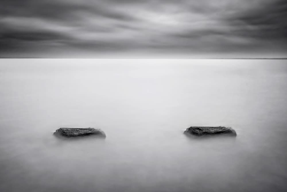 Calm Water Two Rocks by Catalin Alexandru — canvas wall art