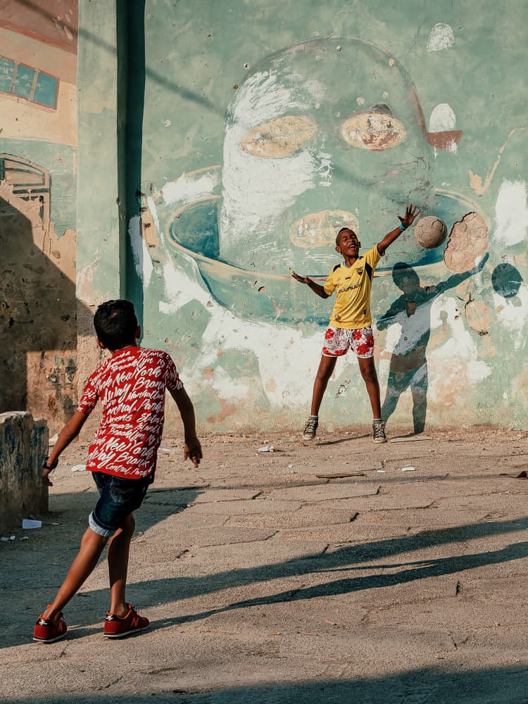 Kids Playing Street Soccer by Andy Bauer — canvas wall art