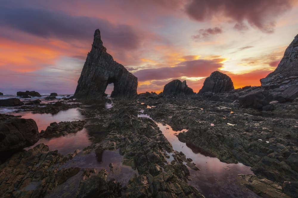Dramatic Coastal Arch Sunset by Rodrigo Núñez Buj — canvas wall art