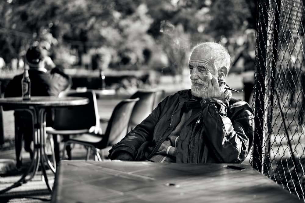 Pensive Old Man Smoking by Denis Malciu — canvas wall art